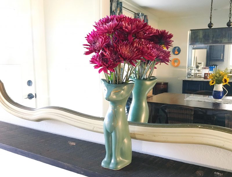 cat vase with flowers