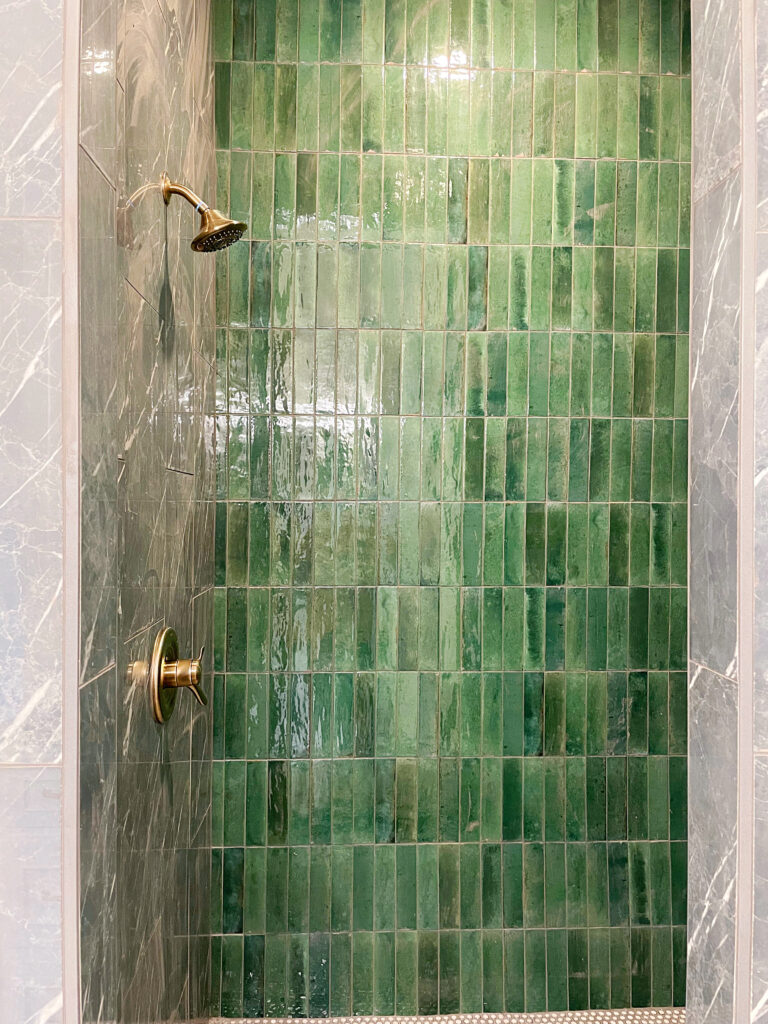 primary bathroom tub green tile shower